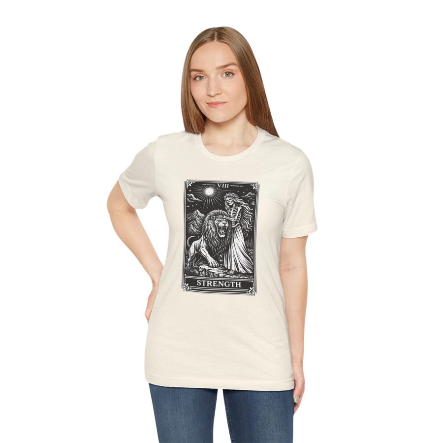 DailyThreadCo. cream 100% cotton t-shirt with vintage Strength tarot card illustration of a woman and lion.