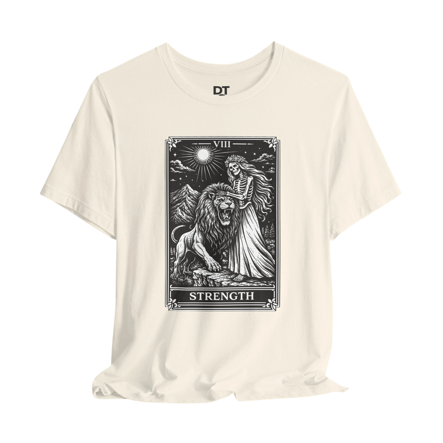 DailyThreadCo. cream 100% cotton t-shirt with vintage Strength tarot card illustration of a skeleton woman with a lion.