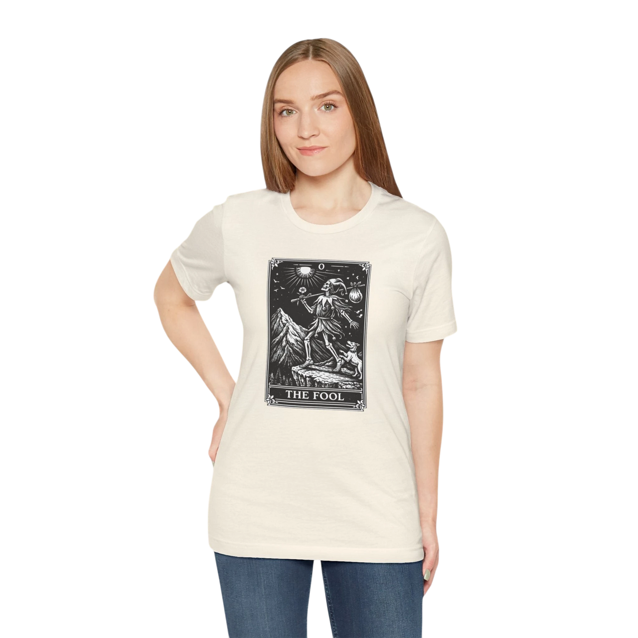DailyThreadCo. cream 100% cotton t-shirt with black and white 'The Fool' tarot card graphic on front. Features mountain and celestial design.