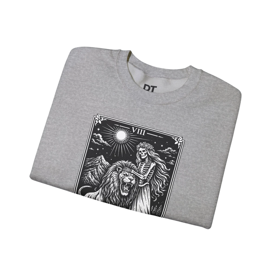 DailyThreadCo. grey crewneck sweatshirt with a black tarot strength card graphic featuring a skeleton woman and a lion.