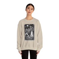 DailyThreadCo. beige crewneck sweatshirt with a black tarot strength card graphic featuring a woman and a lion.