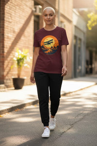 DailyThreadCo. maroon cotton t-shirt with vintage biplane graphic over desert sunset landscape.