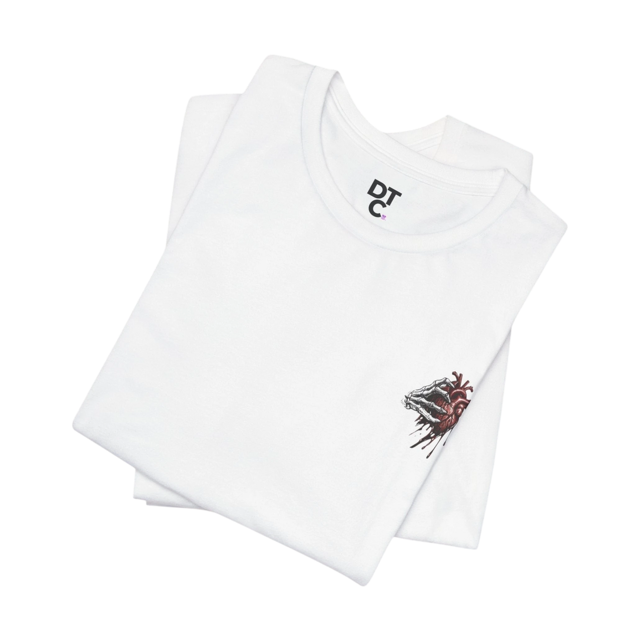 DailyThreadCo white 100% cotton t-shirt with a small graphic of a skeletal hand holding a dripping anatomical heart on the left chest.