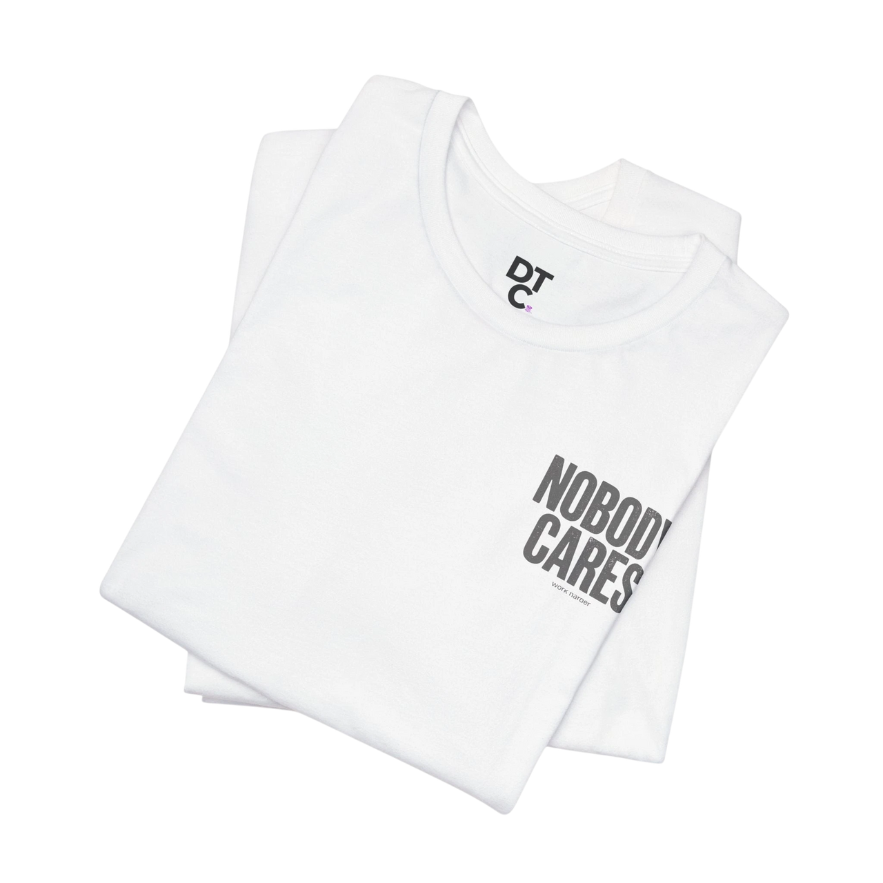 DailyThreadCo. white 100% cotton graphic tee with "Nobody Cares" text and DTC logo.