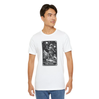 DailyThreadCo. white cotton t-shirt with 'The Fool' tarot card graphic print in black and white, featuring a mountain landscape and celestial symbols.